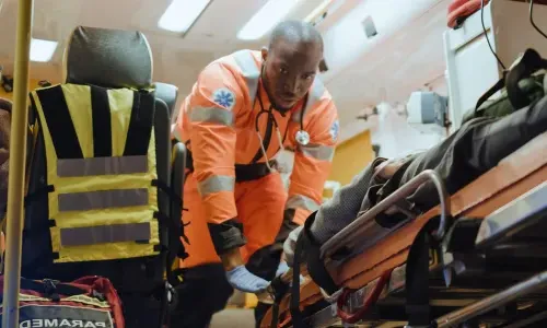 EMT Emergency Medical Technician Loading Patient Into Ambulance