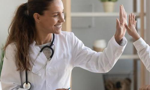 Family Nurse Practitioner FNP High Fiving Child Patient 